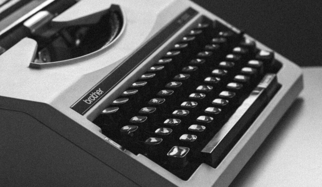 white and black typewriter close-up photography