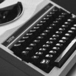 white and black typewriter close-up photography